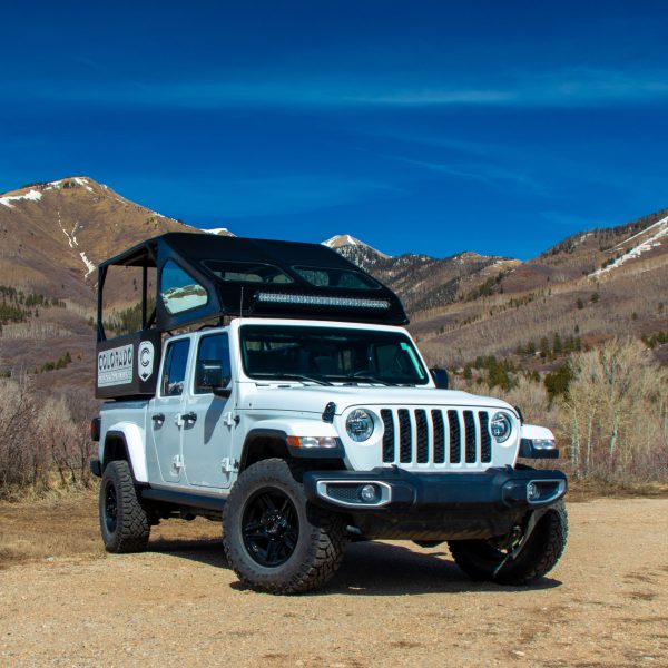 A jeep sits on a forest road in the mountains of Southwest Colorado