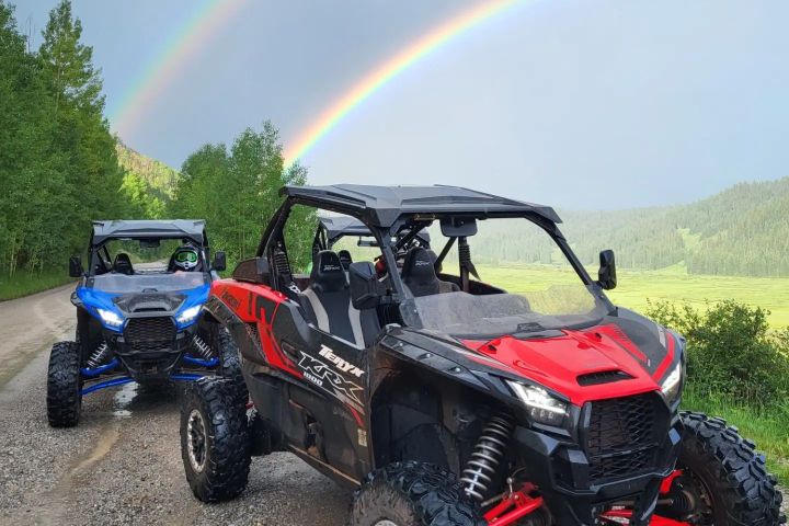 a motorcycle parked on a dirt road