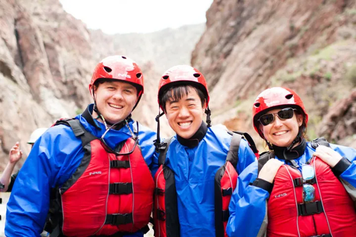a group of people standing on top of a mountain
